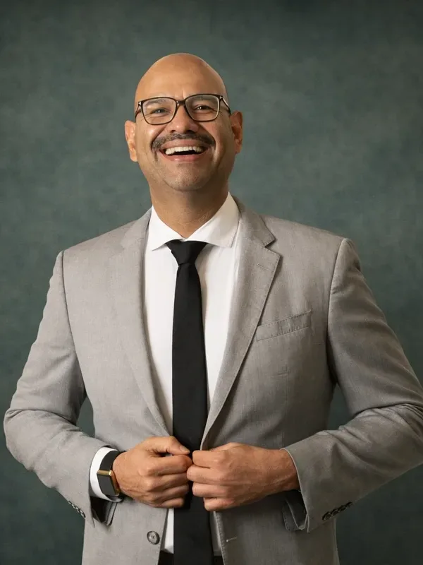 Professional headshot of Carlos